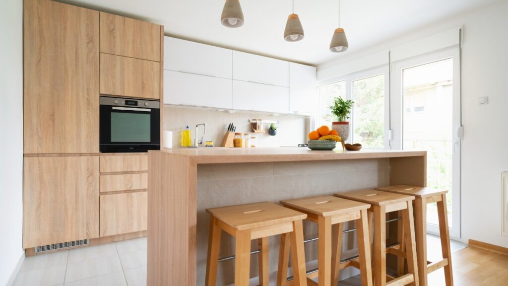 Residential cleaning crew refreshing a modern kitchen space.